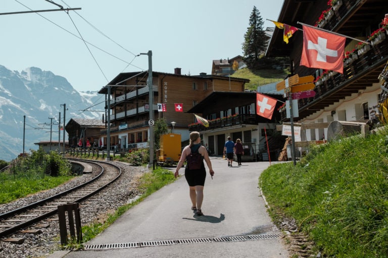 People walking into the town of Murren, Switzerland.