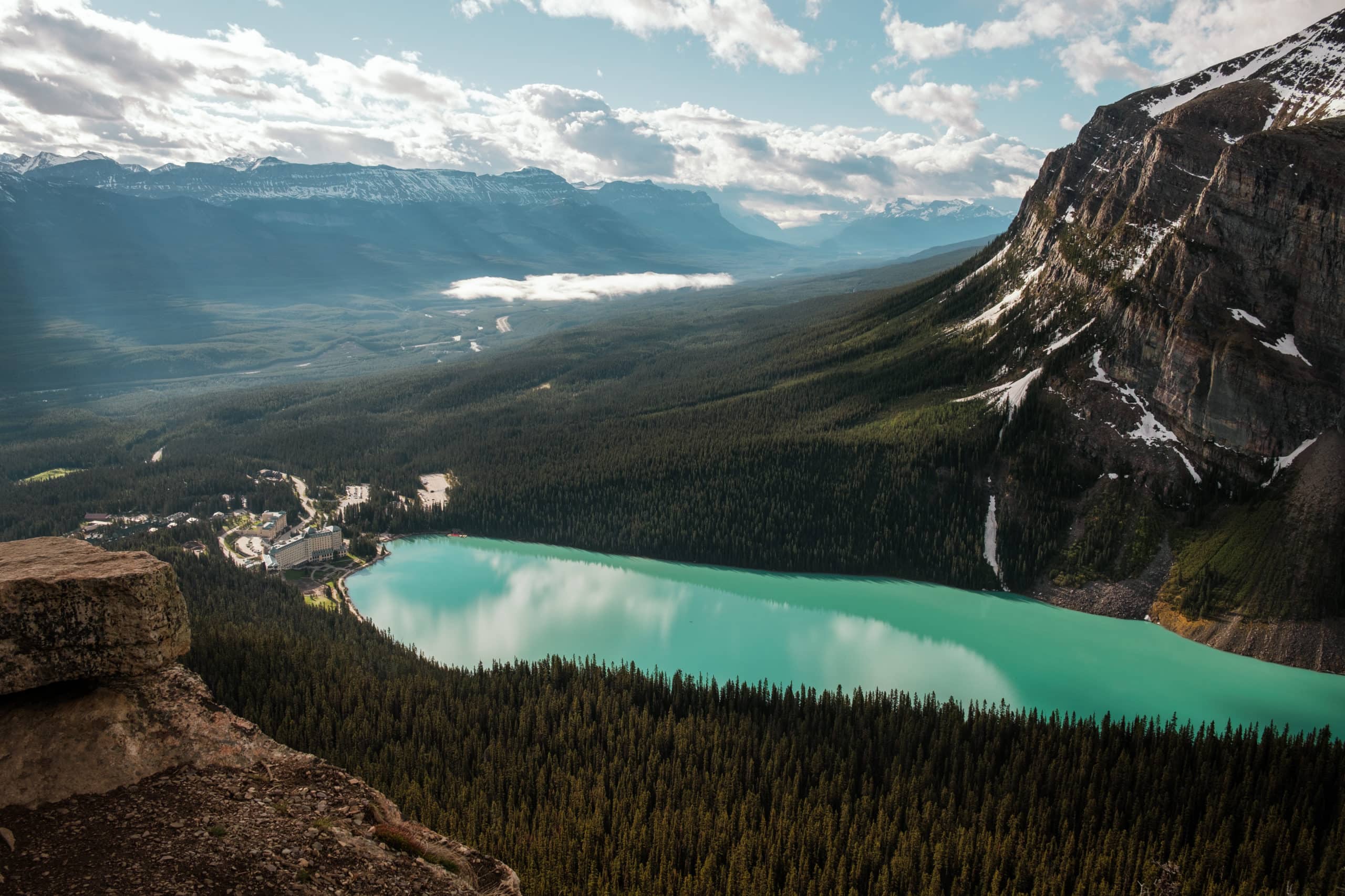 The view of the bright turquoise Lake Louise from Little Beehive.