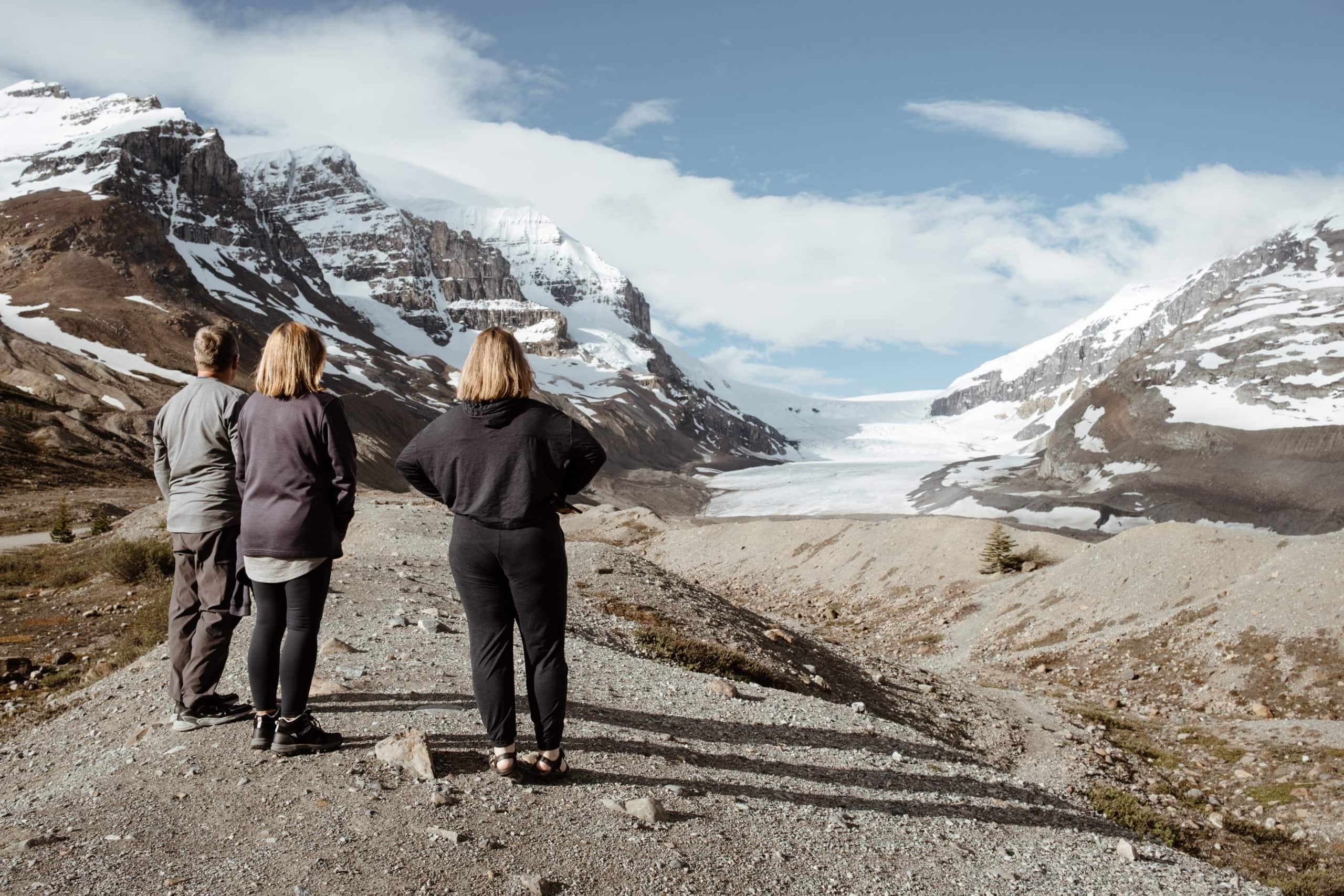 People look at a toe of the Athabasca Glacier.