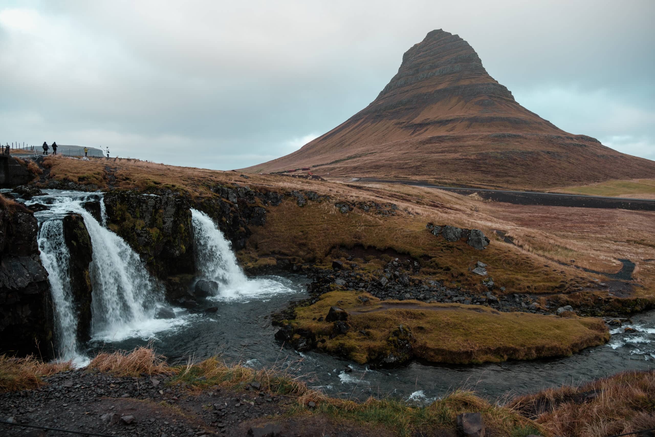 Kirkjufell stands behind Krikjufellsfoss.