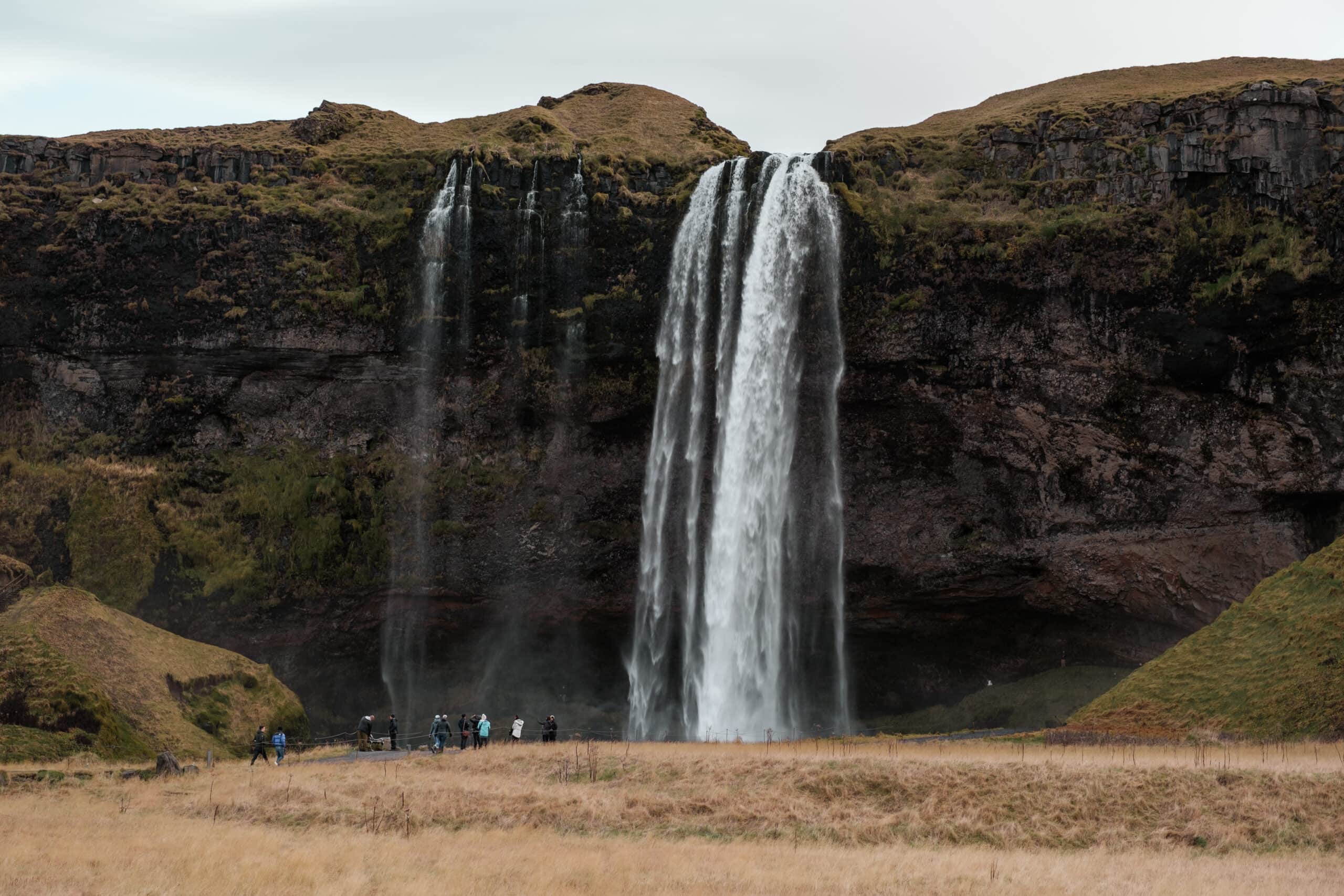 Seljalandsfoss pours over a cliff.