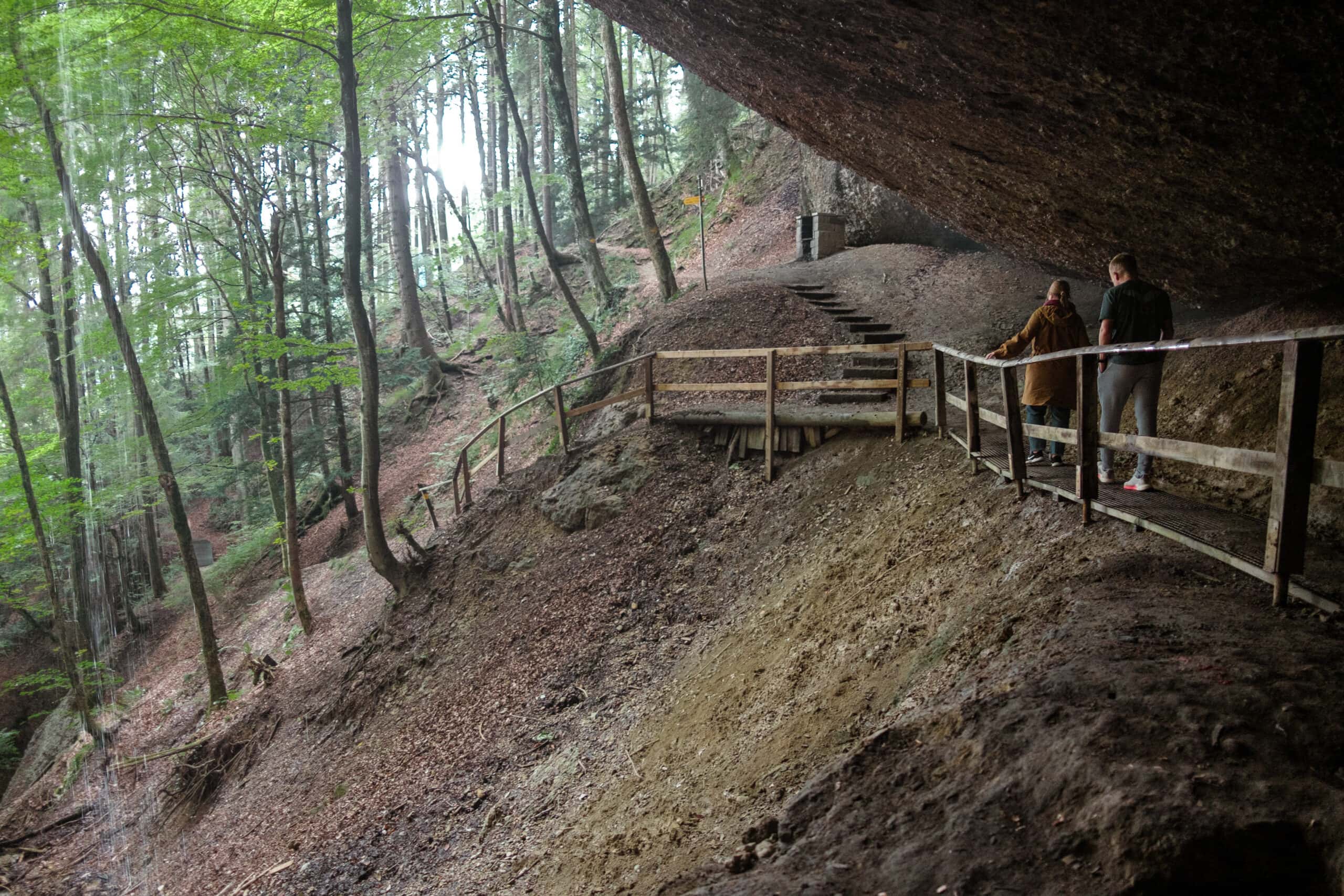 People walk along the entrance to Tauferhohle.