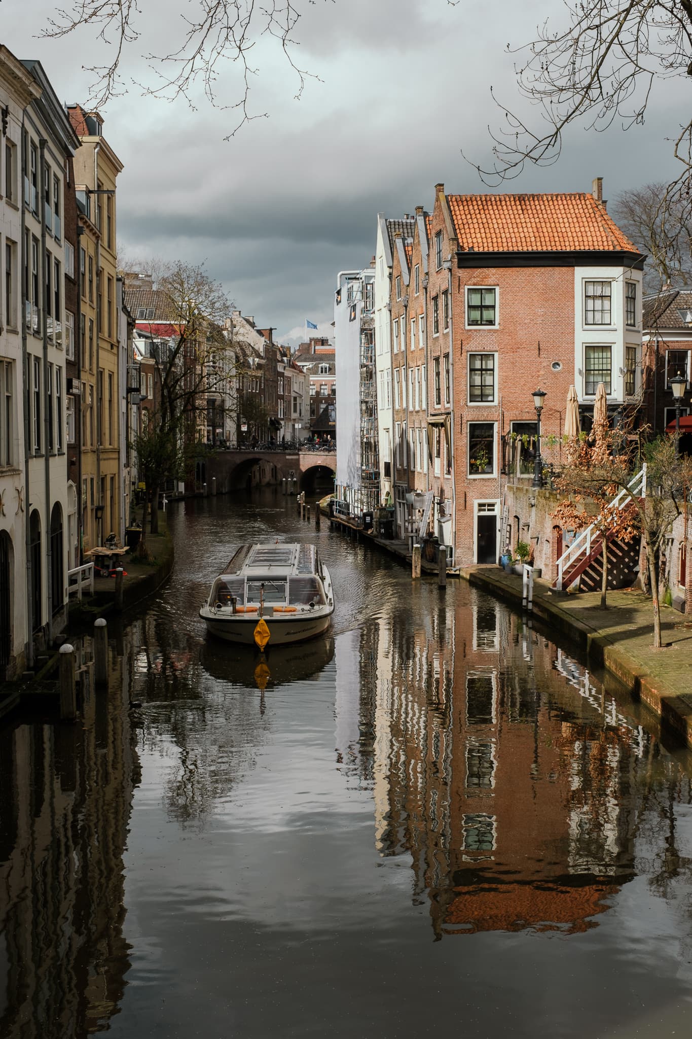 A boat glides down a canal in Utrecht.