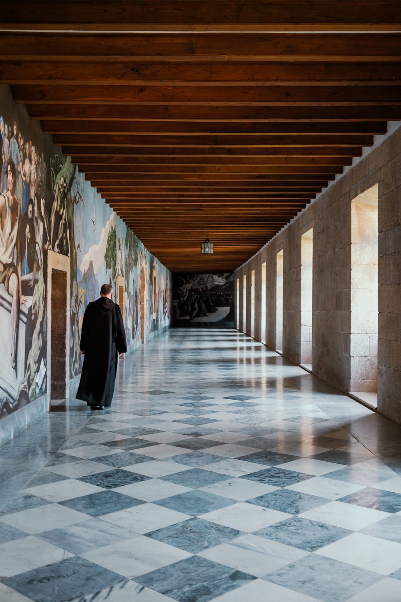A monk walks through the halls of the Samos monastery.