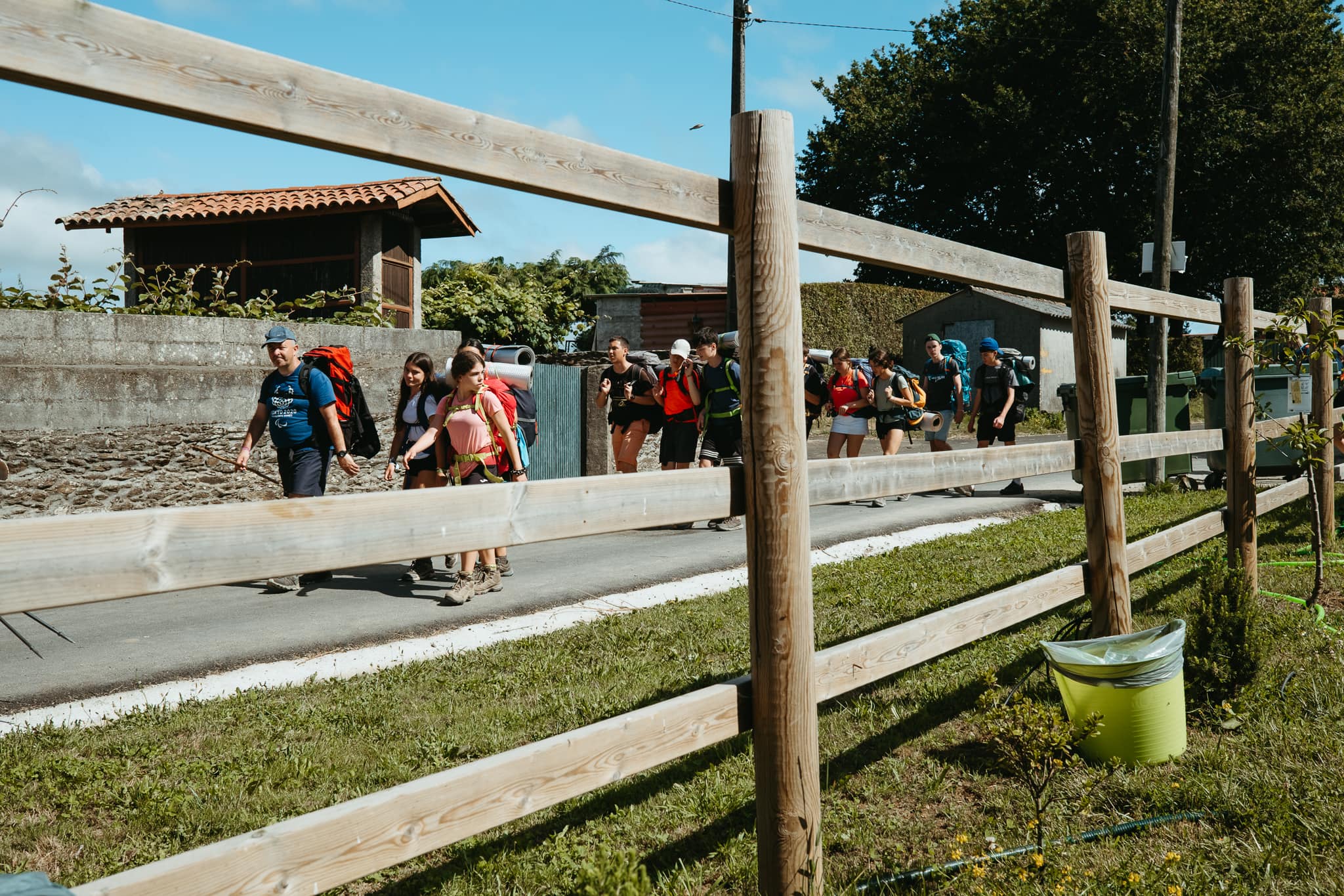 A group of teenagers walks the Camino.
