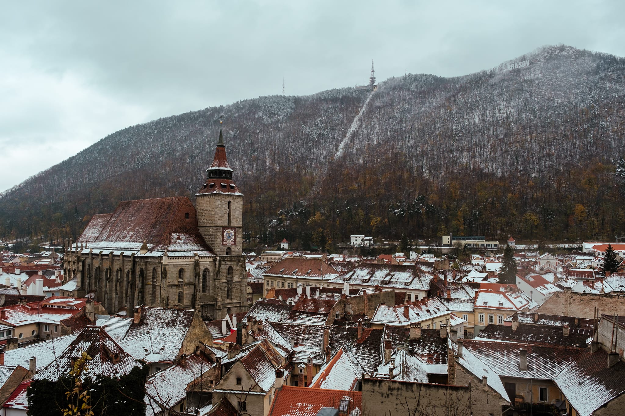 Rooftops in Brasov, Romania, lightly dusted with snow.