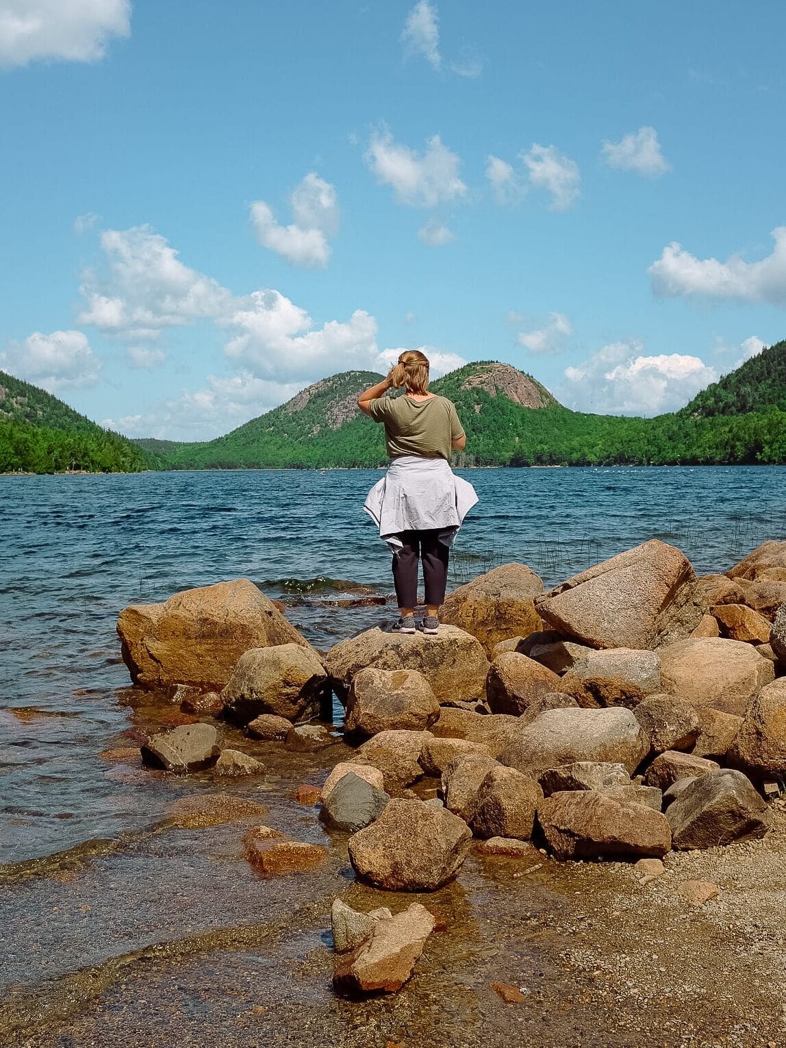 My sister standing beside Jordan Pond.