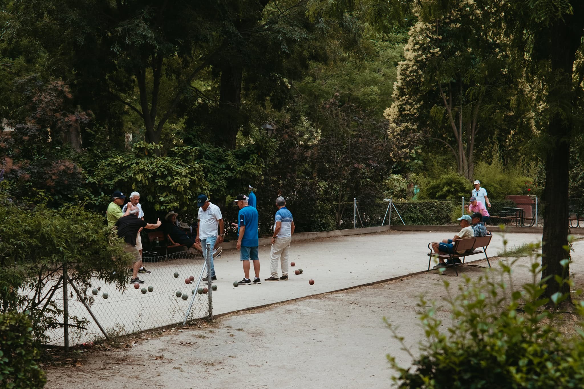 Men play bocce in Parque de El Retiro, Madrid.