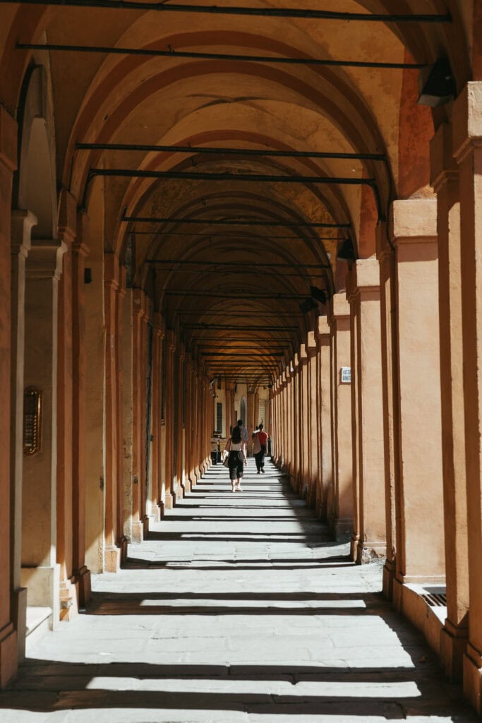 Pillars casting shadows on the Portico di San Luca.