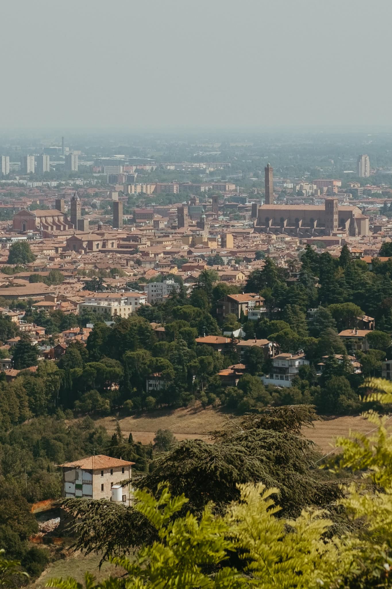 View of churches and rooftops in Bologna from the Portico di San Luca.