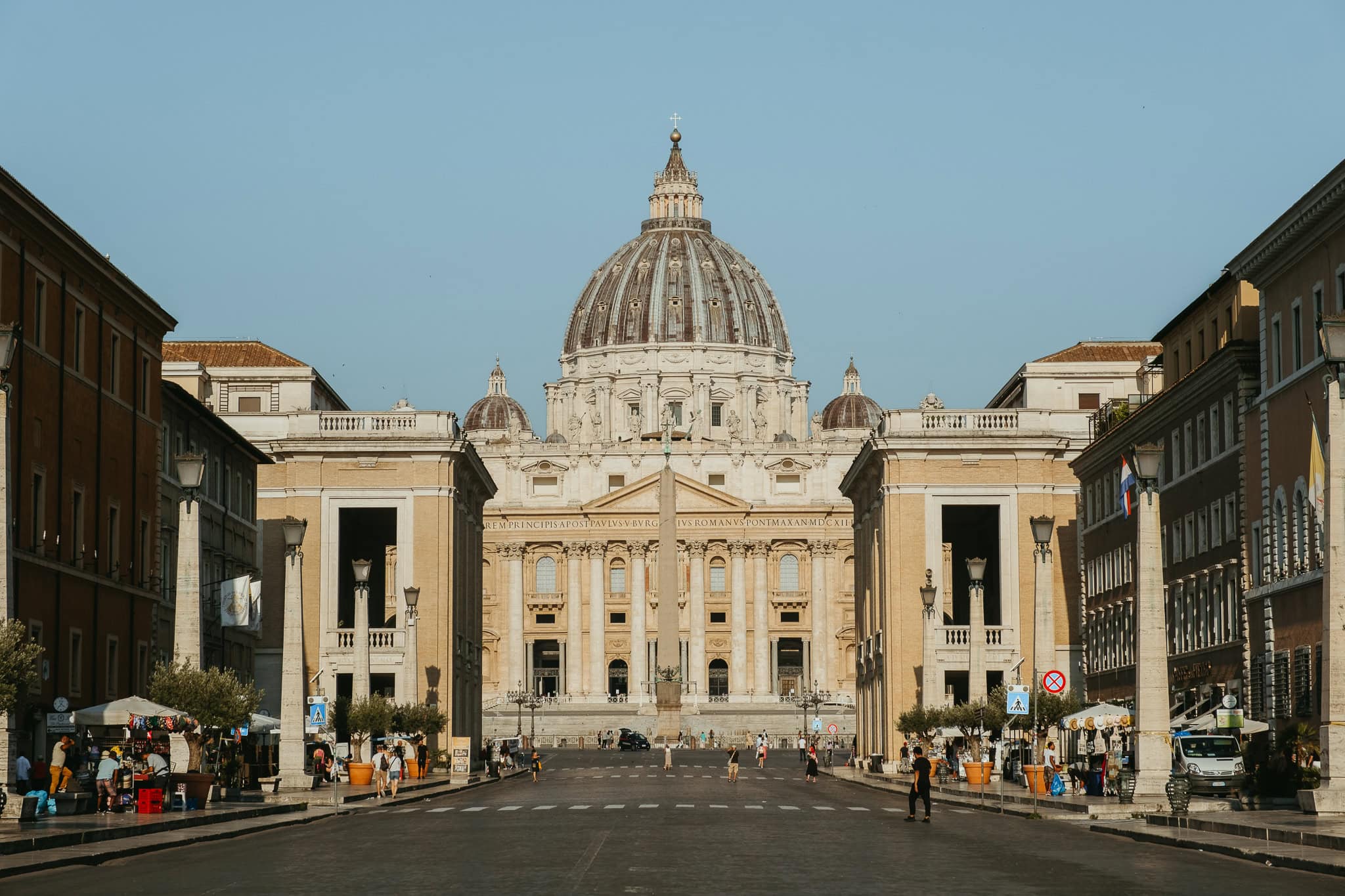 St. Peter's Basilica at the end of an empty road.