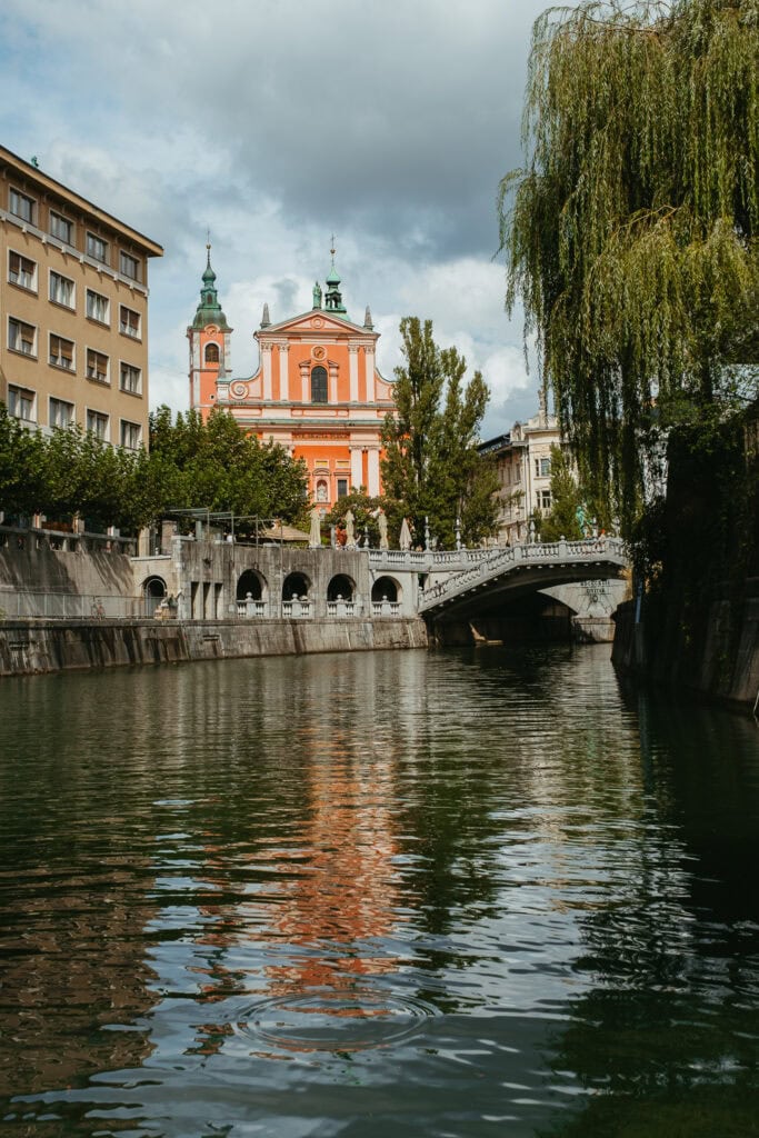 The pink Franciscan Church, as seen from the river.