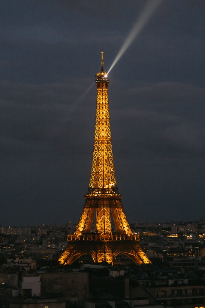 The Eiffel Tower lit up at night.