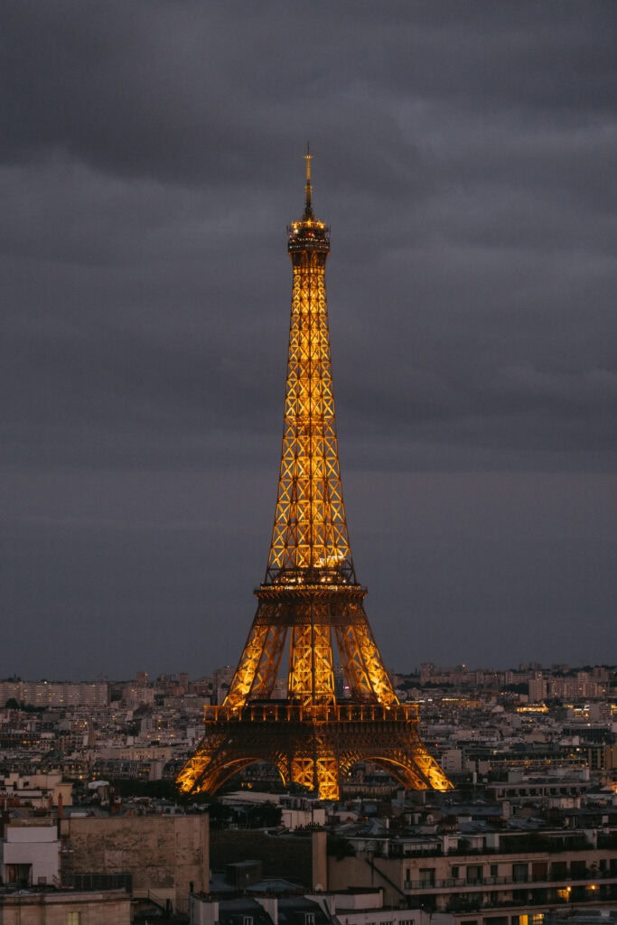 The Eiffel Tower lit up in the evening.