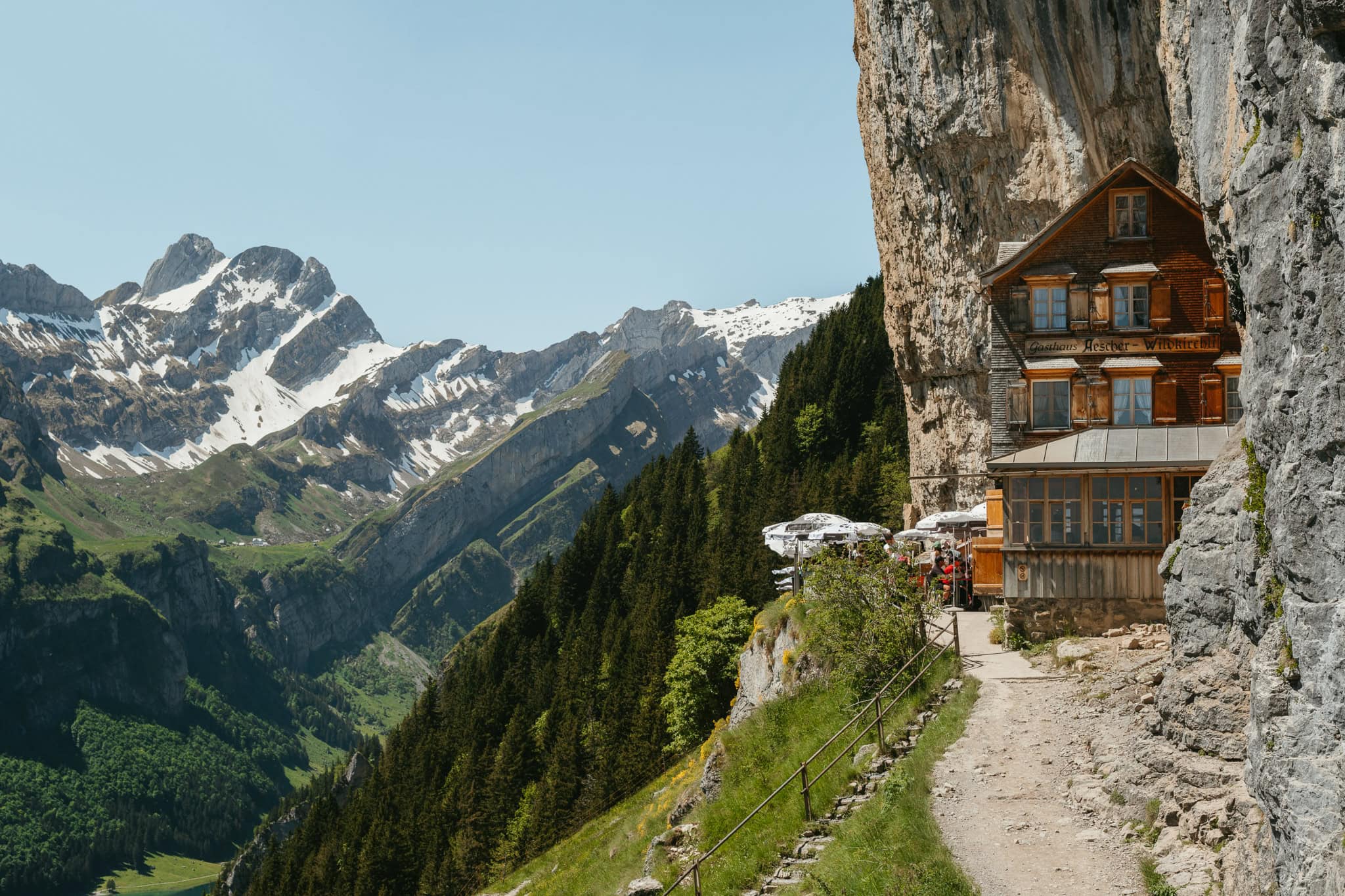 A historic guesthouse sitting on the side of a cliff.