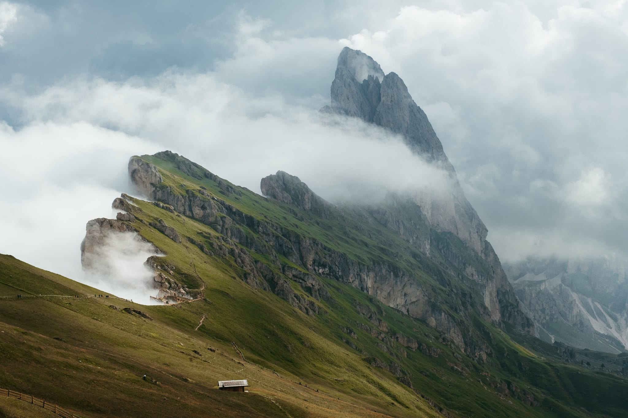 Seceda in the midst of clouds and fog.