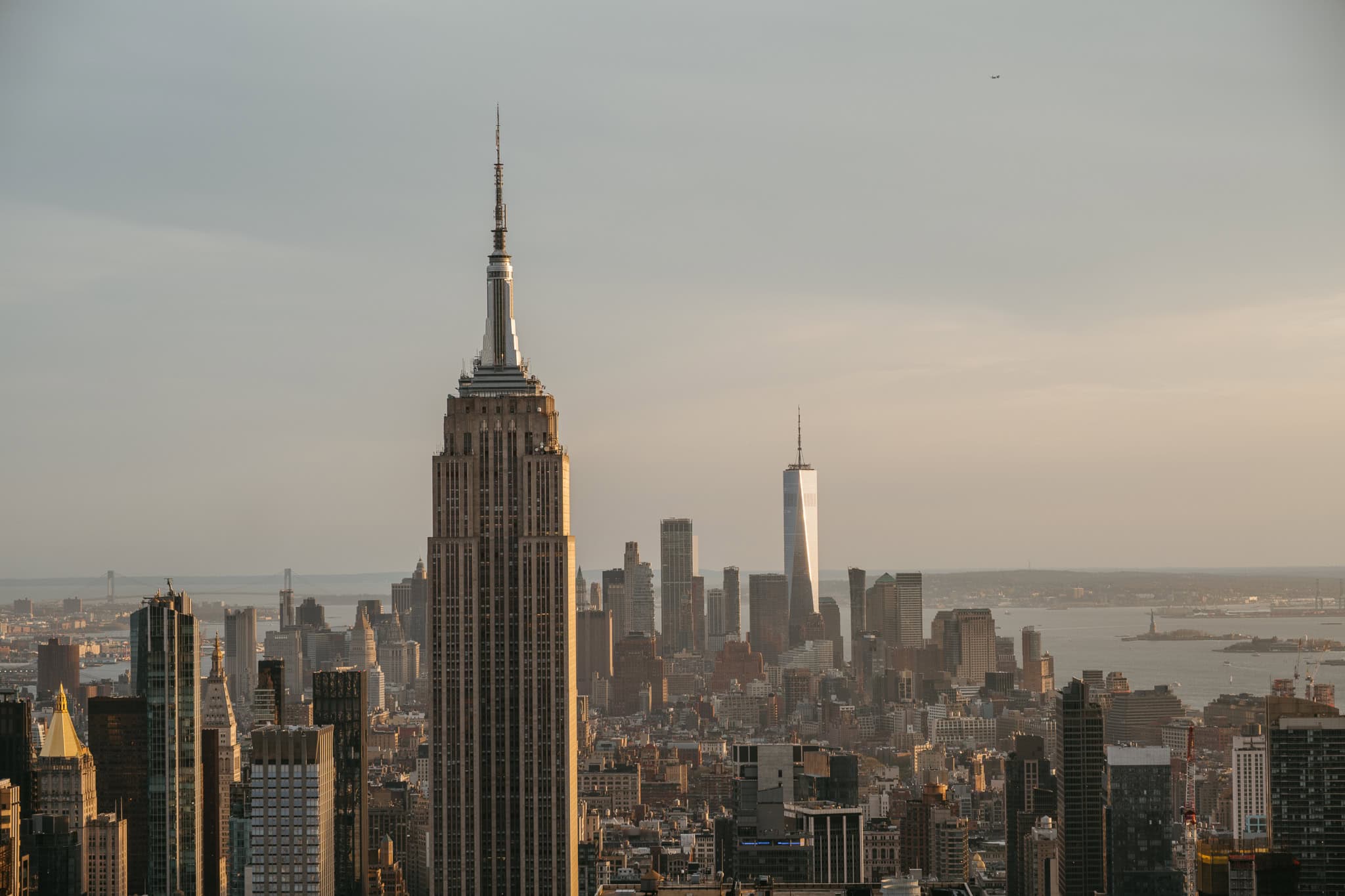 The Empire State Building and other Manhattan buildings, as well as the Statue of Liberty.
