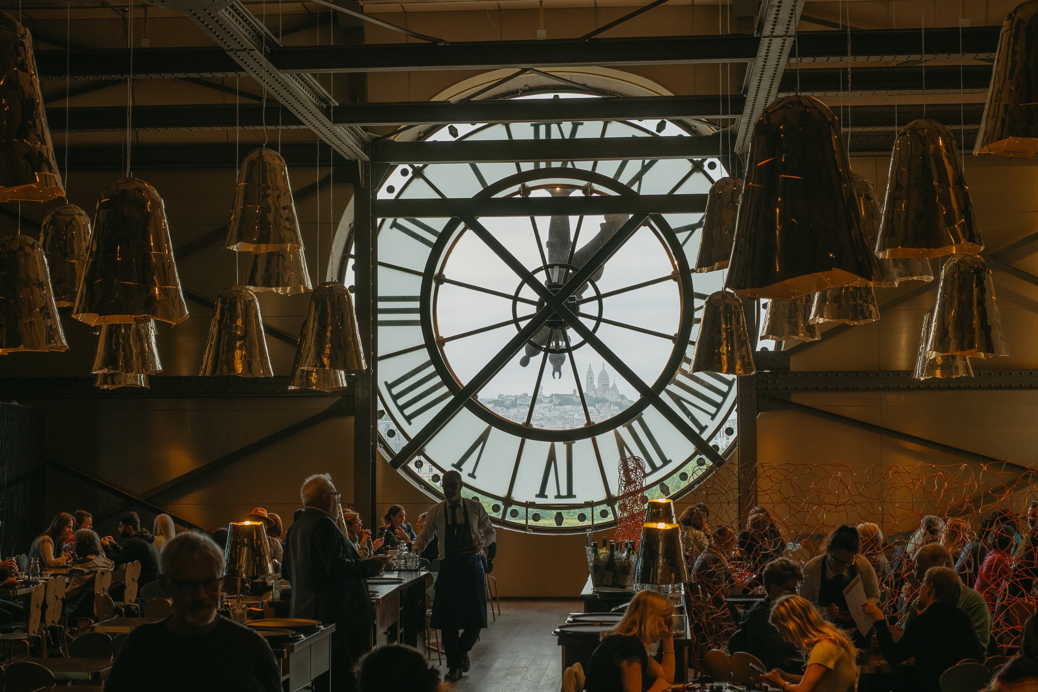 A large clock window in a cafe.