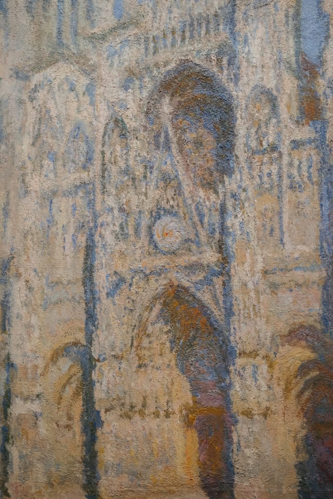 Closeup of a painting of a cathedral.