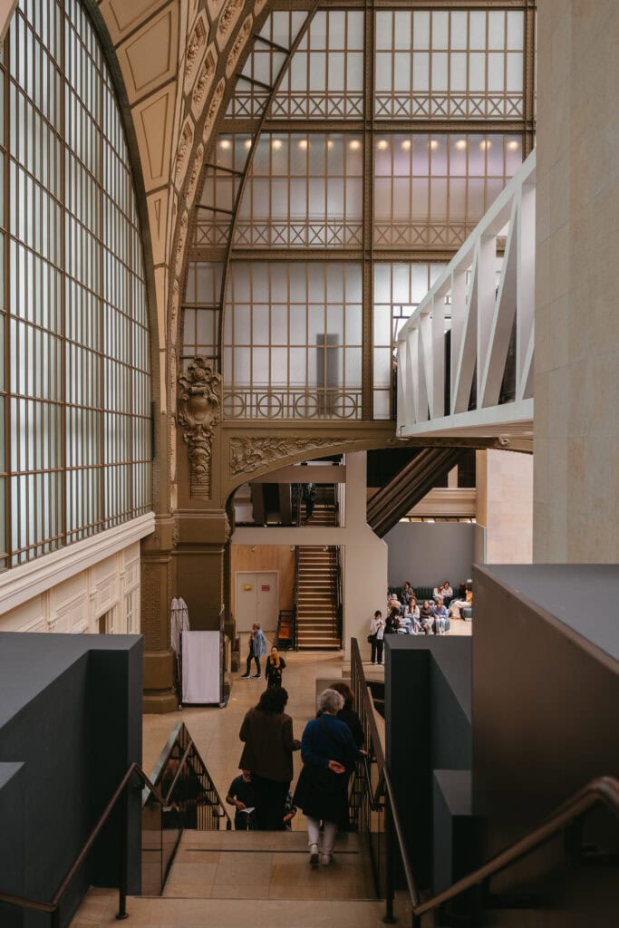 The end of Musee d'Orsay's main hall, with a big wall of windows.
