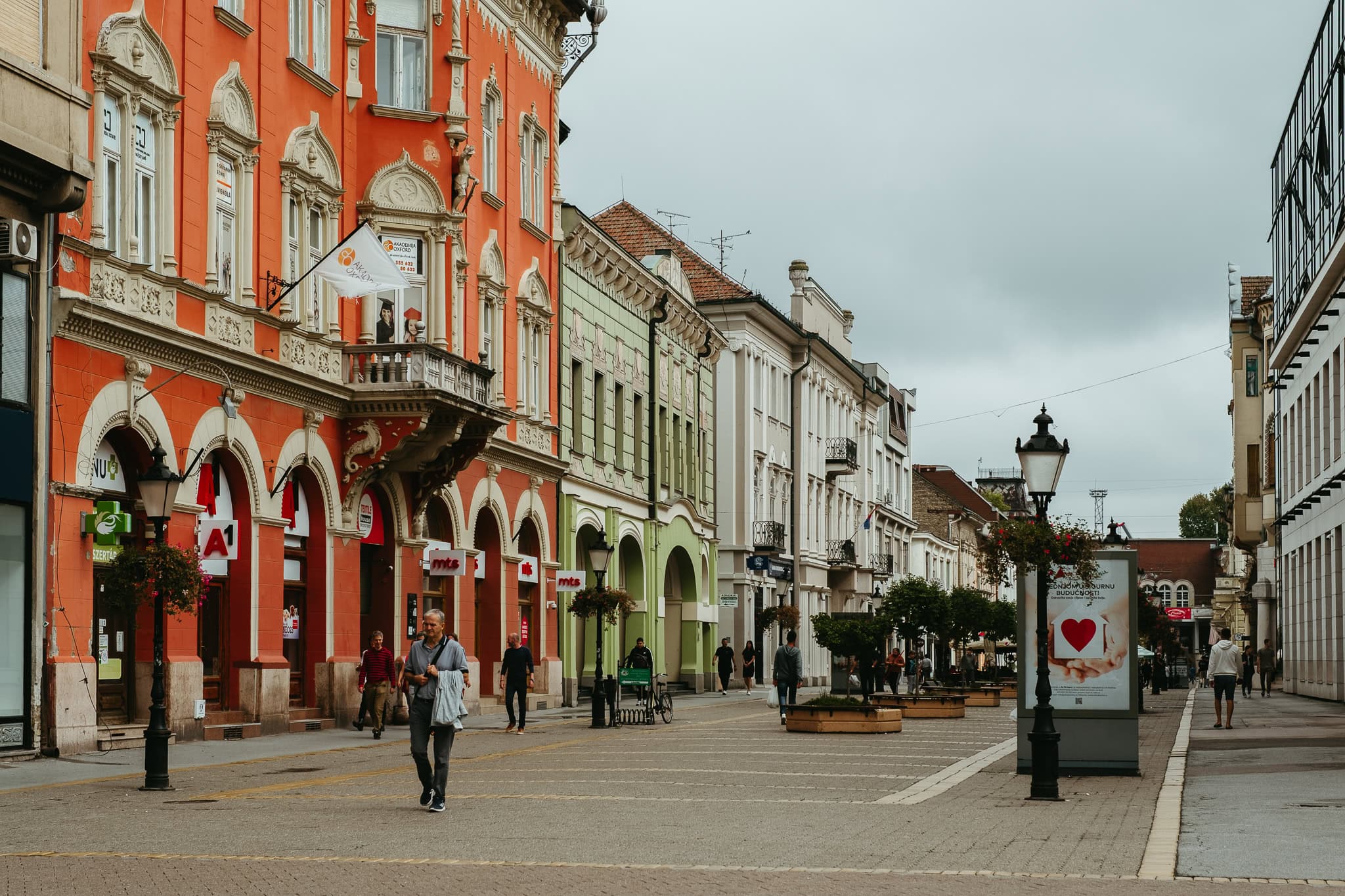 A pedestrian street with colorful buildings.