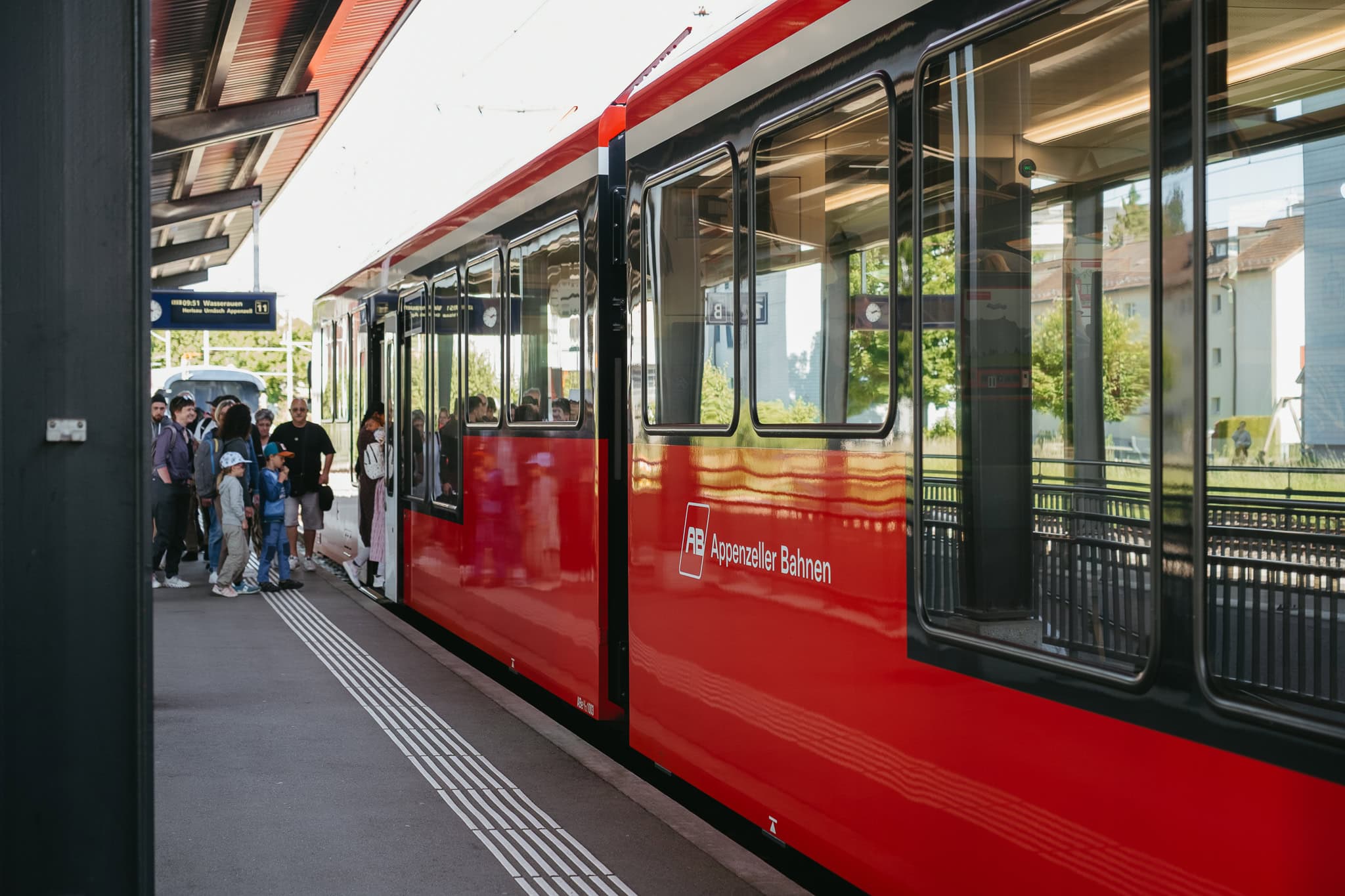 A red train labeled "Appenzeller Bahnen."