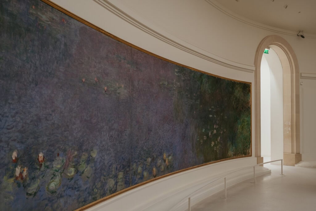 A large purple painting of water lilies.