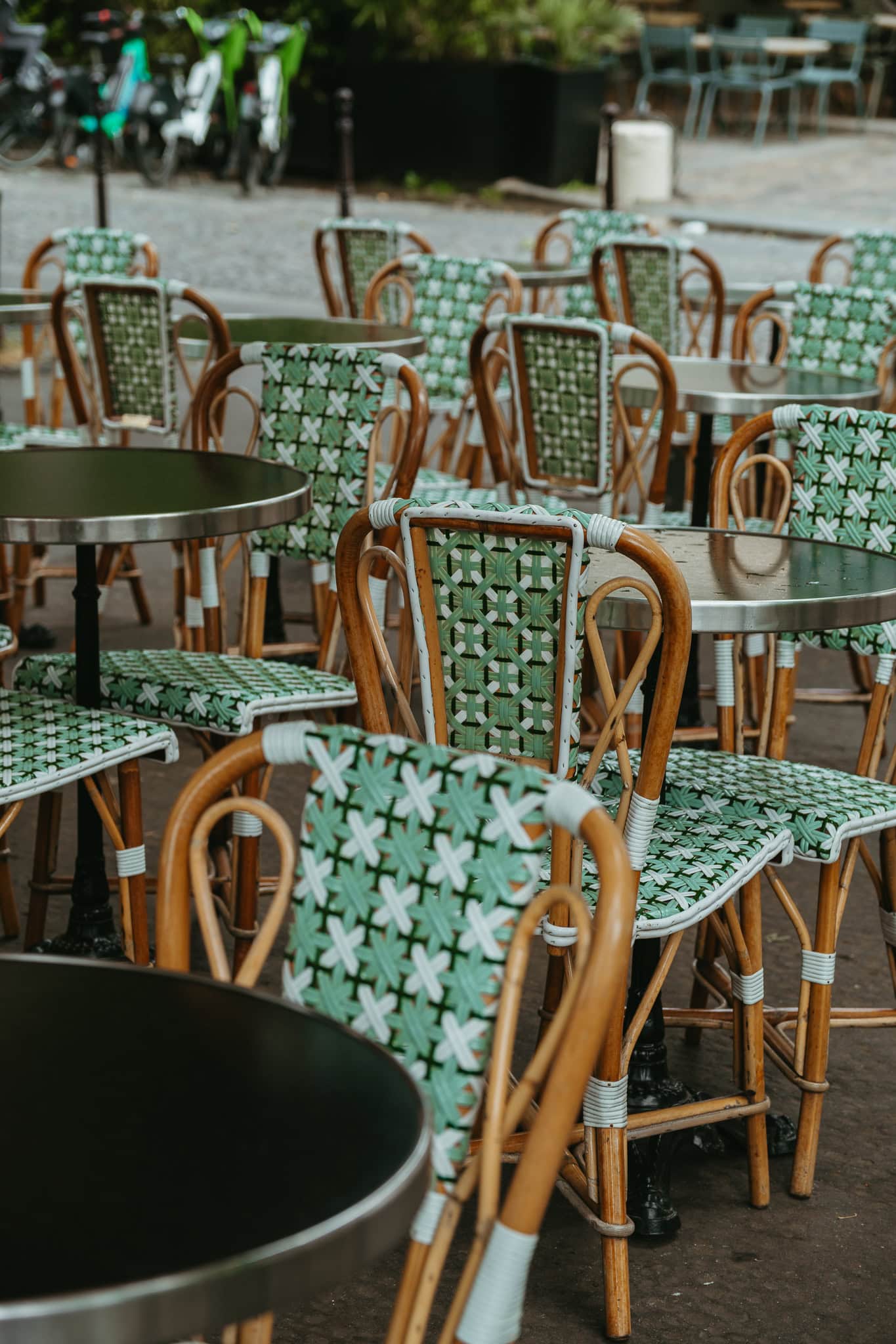 A group of green cafe chairs.