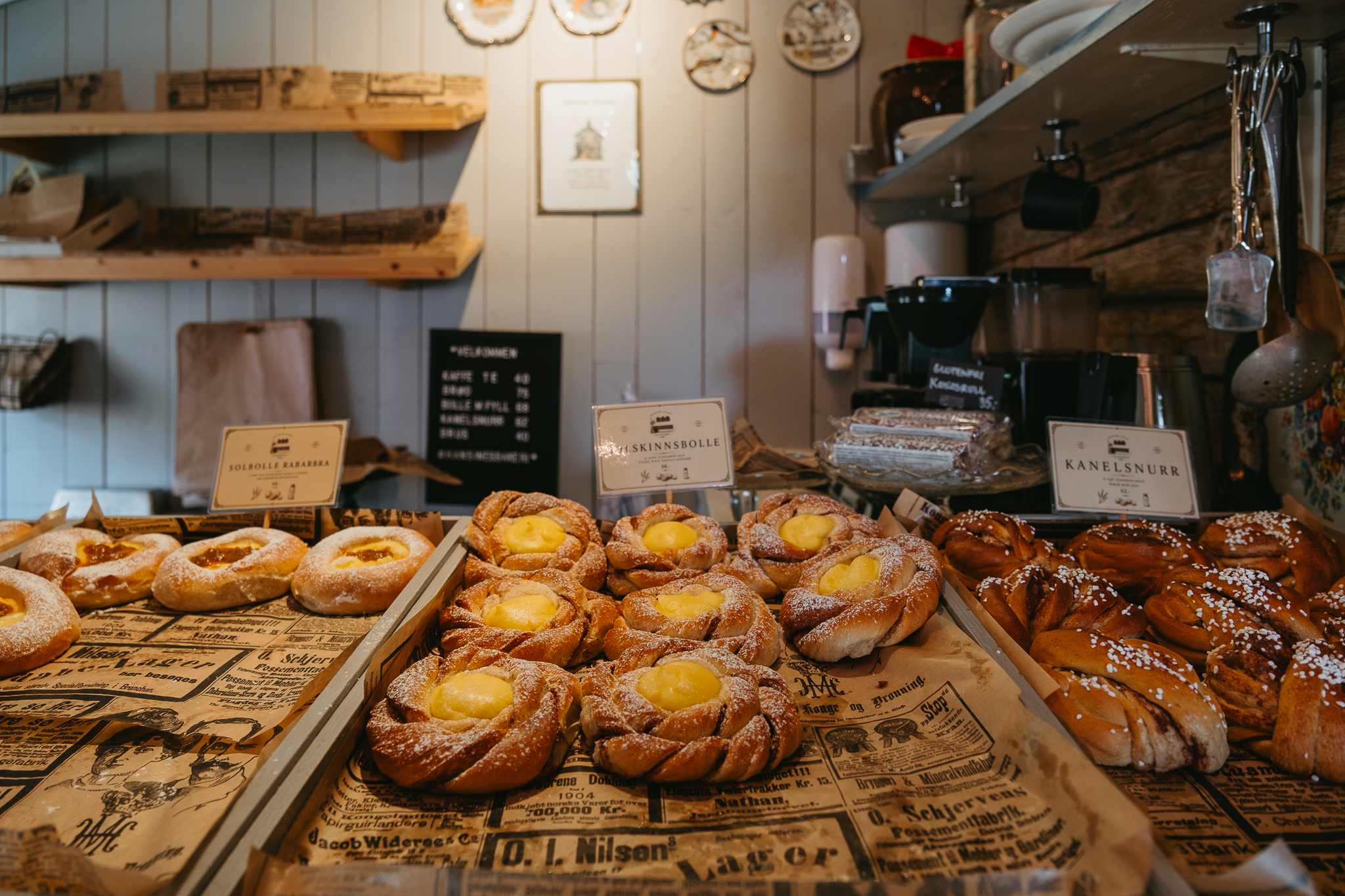 Trays of pastries with labels identifying them.